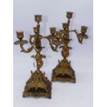 A pair of Rococo style gilt metal four sconce table candelabra, h.37cm