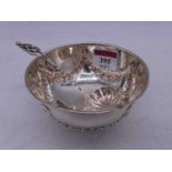 A Victorian silver bowl repoussee decorated with floral swags, Chester 1896, dia. 10cm, 3.5oz,