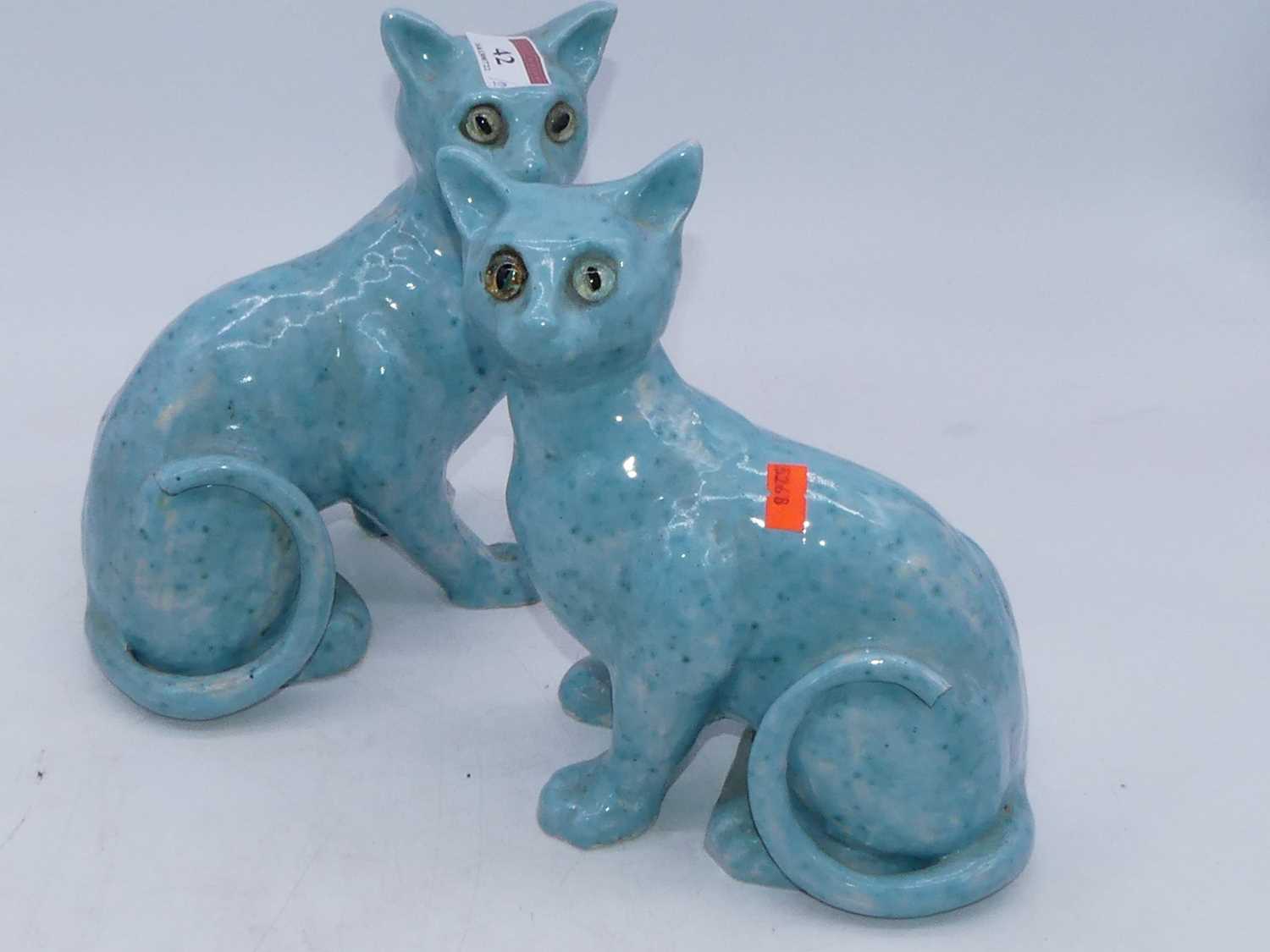 A pair of Galle style cats, each modelled in seated pose on a turquoise ground with glass eyes, - Image 2 of 3