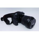 A Sony AX digital SLR camera, having Sigma 72mm lens, with travel case