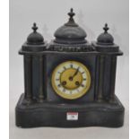 A Victorian black slate 8-day mantel clock, of architectural form, the enamelled chapter ring