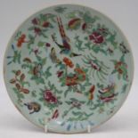 A 19th century Chinese Canton export plate, on a celadon ground, enamel decorated with exotic birds,