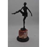 An Art Deco style bronze figure of a female dancer, mounted upon a polished hardstone plinth, height