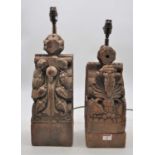 Two Indonesian carved teak corbels, later converted into table lamps, largest height 51cm