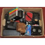 A box of photography equipment and binoculars to include a Polaroid camera