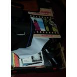 A box of photography equipment to include lenses, flashes, tripod etc