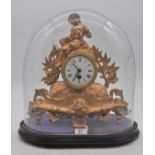 A 19th century French gilt metal figural mantel clock, the enamel dial showing Roman numerals,