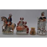 A collection of three Victorian Staffordshire earthenware figures, largest 31cm high, together