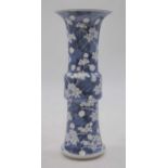 A Chinese export porcelain vase of gu form, in the prunus pattern, four-character underglaze blue