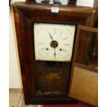 An early 20th century American mahogany drop trunk wall clock