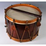 A snare drum of typical form, having a stained bentwood body with Amrawco 16" calf skin head,