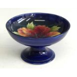 A small Moorcroft Hibiscus pattern pottery comport, underglaze tube-line decorated to the