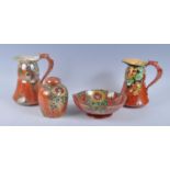 A collection of Art Deco Grimwades Royal Winton orange lustreware, to include; a Tiber Bubbles