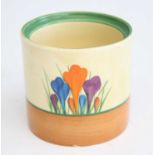 A 1930s Clarice Cliff Crocus pattern pottery cylindrical sugar, having black painted backstamp