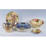 A collection of Art Deco Grimwades Royal Winton yellow lustreware, to include; a Carnation pattern