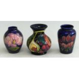 A Moorcroft Queen's Choice pattern pottery miniature vase, h.9.5cm, together with a Moorcroft