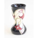 A contemporary Moorcroft Dewdrop pattern vase, of waisted form, underlaze tube-line decorated with