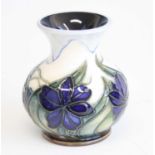 A contemporary Moorcroft Chilean Crocus pattern vase, of squat baluster form, underglaze tube-line