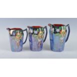 A gradated set of three Art Deco Grimwades Royal Winton Oriental Poppies pattern blue lustreware