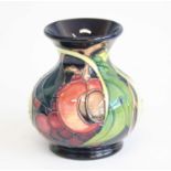 A contemporary Moorcroft Queen's Choice pattern vase, of squat baluster form, underglaze tube-line