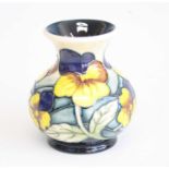 A contemporary Moorcroft Yellow Pansy Parade pattern vase, of squat baluster form, underglaze tube-