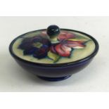 A Moorcroft Clematis pattern pottery jar and cover, underglaze tube-line decorated to the cover,