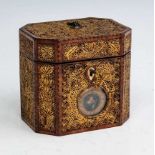 A late 18th century barber pole strung mahogany and gilt scrollwork tea caddy, the lid with brass