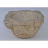 A 19th century North European marble mortar, of circular tapering form, with four lugs each carved