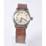 A vintage gent's Rolex manual wind wristwatch, in stainless steel with a round cream Arabic dial and