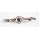 A late Victorian rose metal, sapphire and diamond cluster style bar brooch, comprising a centre