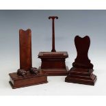 A 19th century mahogany charger stand, the scrolled rest above a rectangular base, h.47cm,