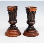 A pair of William IV carved fruitwood vases, each having lapit moulded decoration and standing