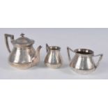 A Victorian silver three-piece bachelors tea set, comprising teapot, twin handled sugar, and milk