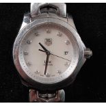 A lady's Tag Heuer Link steel bracelet watch, having a signed silvered dial with diamond set
