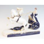 A Royal Dux porcelain group, modelled as a classical chariot driven by a semi-robed standing maiden,