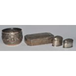 A white metal alloy sirih (betel) box, of canted rectangular form having a hinged domed cover and