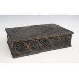 A 19th century carved oak box, the whole being Asian influenced, the frieze with five blind carved