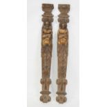 A pair of carved oak and parcel-gilt figural corbels, probably 18th century, each as a head and