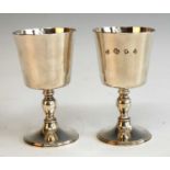 A pair of late 20th century Garrard & Co silver goblets, of plain slightly tapered form to a