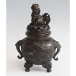 A Japanese bronze koro and cover, 20th century, the cover surmounted with a Dog of Fo, the koro with