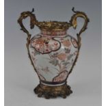 A Japanese Meiji period Imari porcelain vase, having European Rococo gilt metal mounts, enamel
