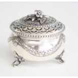 An Edwardian silver pot pourri bowl and cover, the bowl cast with foliate swags and flowerheads in