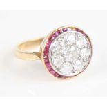 A yellow and white metal, ruby and diamond circular cluster ring, comprising eight Old European