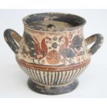 A Greek pottery vase, of squat circular form having twin loop handles, the freize bi-chrome