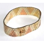 A 9ct yellow, white and rose gold textured five-row brick link bracelet in a triangular pattern,