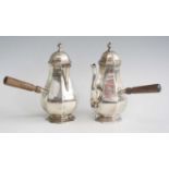 An Edwardian silver coffee and chocolate pot duo, each of octagonal faceted baluster form to a