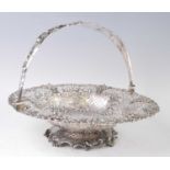 A William IV silver swing handle bread basket, of pierced circular form, profusely pierced and