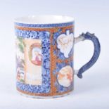 An 18th century Chinese export porcelain tankard, decorated with a cartouche depciting figures