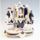 A Royal Dux porcelain figure group, modelled as two porters flanking a sedan chair containing a lady