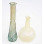 An aqua glass vial, having a flared circular rim to a slender neck and teardrop shaped body, Greco-